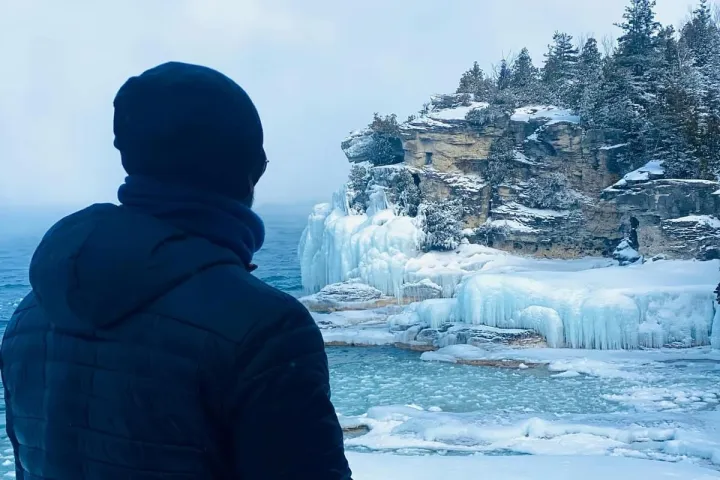 a couple of people that are standing in the snow