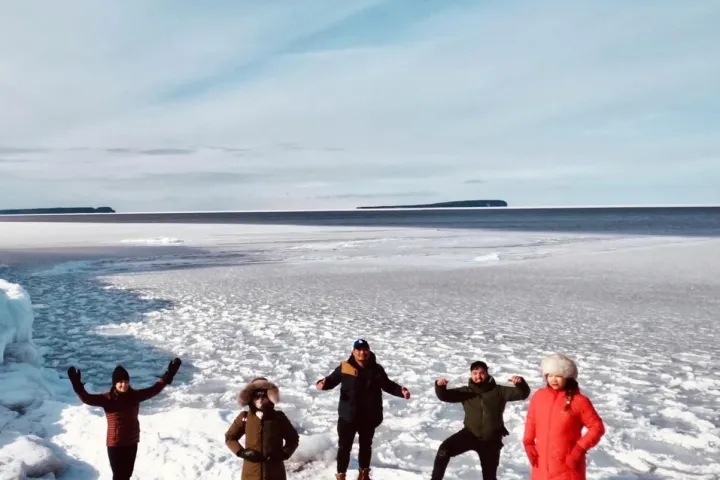 a group of people that are standing in the snow