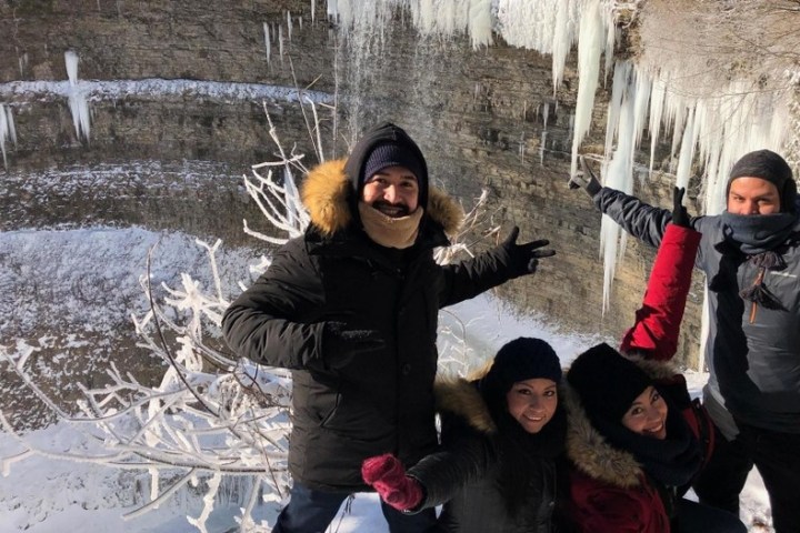 a group of people posing for a picture in the snow