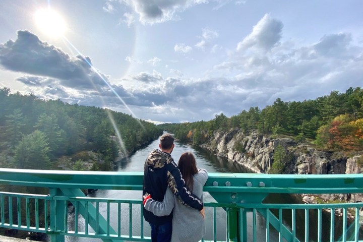 a person standing in front of a fence