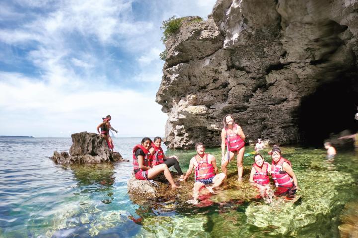 a group of people swimming in the water