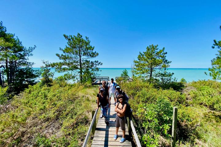 a person standing next to a tree