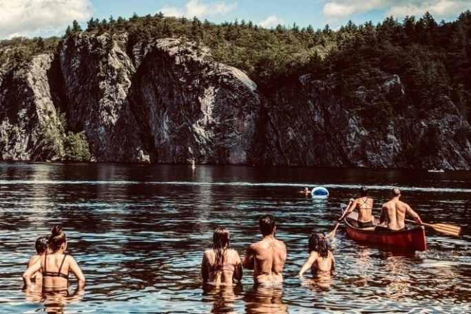 a group of people on a boat in the water