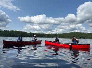 a group of people riding on the back of a boat