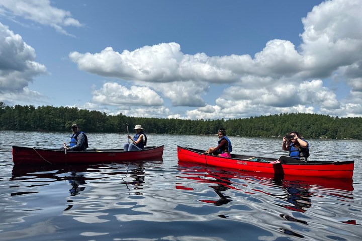a group of people riding on the back of a boat