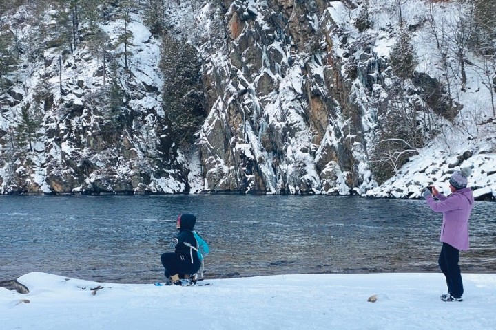 a person riding a snow board in the water