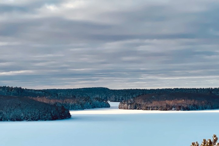 a body of water with a mountain in the background