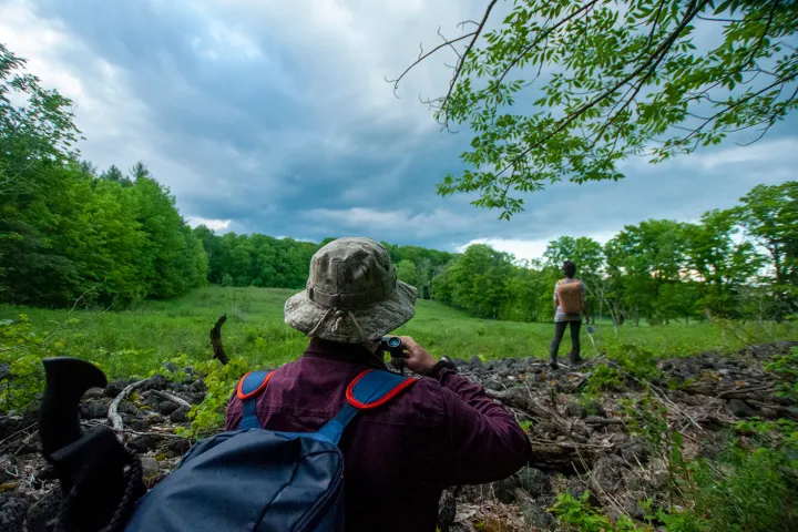 a group of people sitting in a field