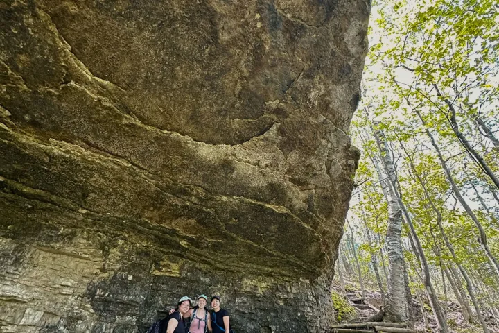 a group of people on a rock