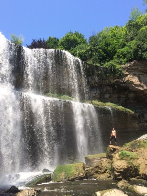 a large waterfall over some water with Snoqualmie Falls in the background