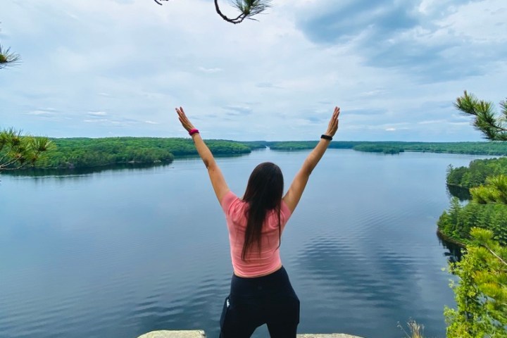 a person throwing a frisbee in a body of water