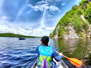 a person standing next to a body of water