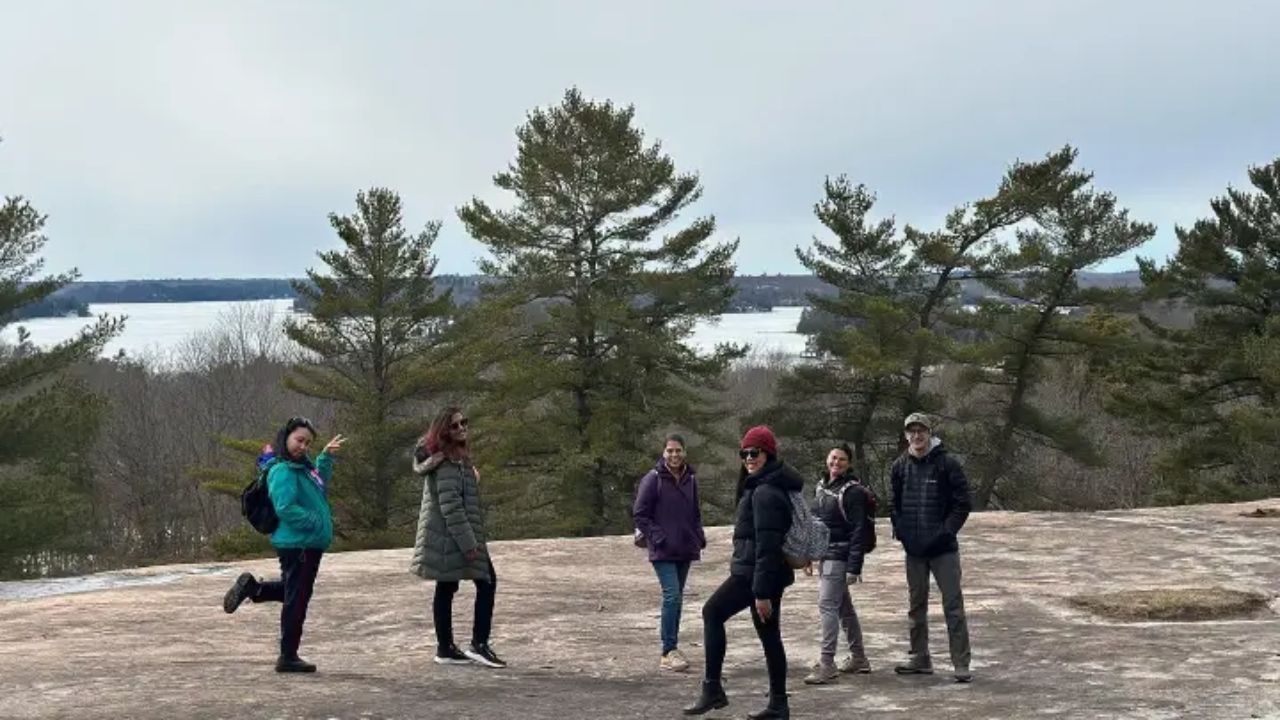 A group of people posing at Muskoka after a hike