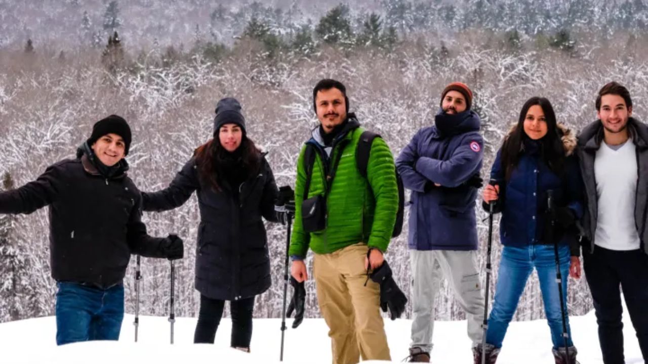 A group of friends standing in deep snow in Algonquin Provincial Park