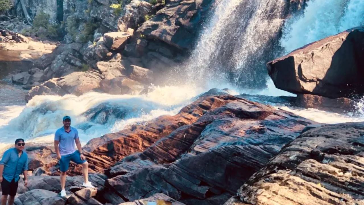 Hikers standing on rocks at Muskoka