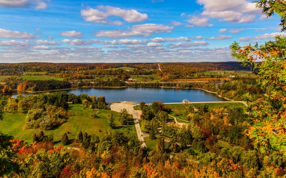 Scenic view of Kelso Lake surrounded by autumn forests and countryside at Kelso Conservation Area in Milton.